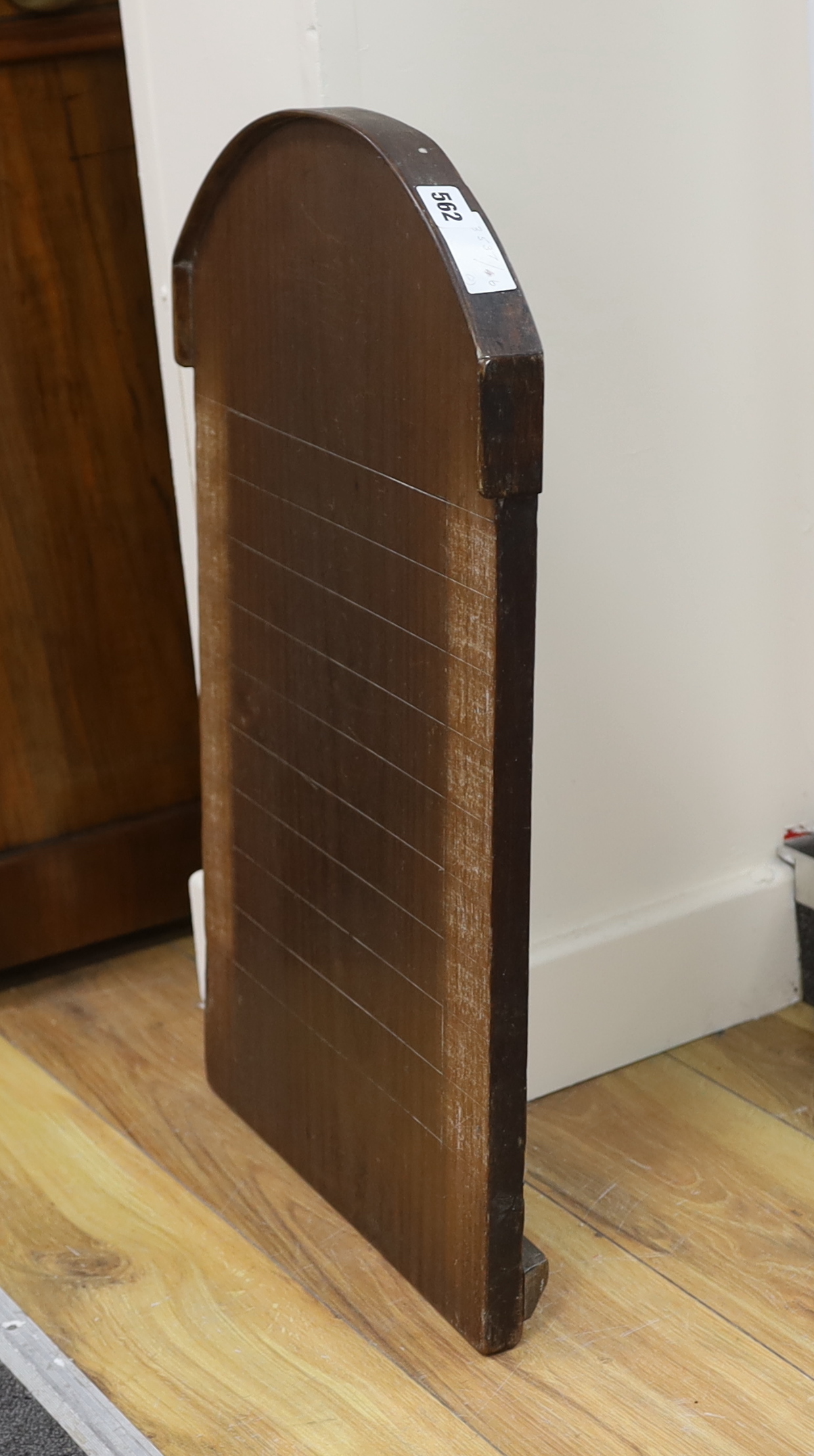 A mahogany Shove Ha’penny board